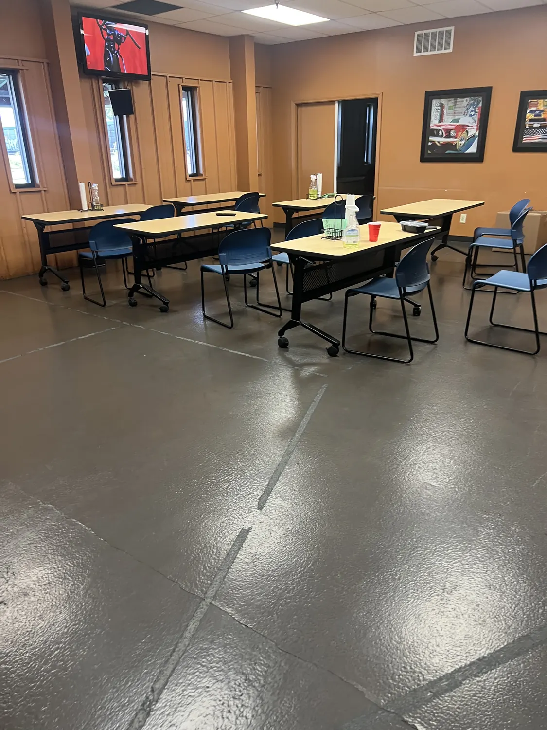 Existing epoxy coating over concrete with slab control joints showing through the surface
