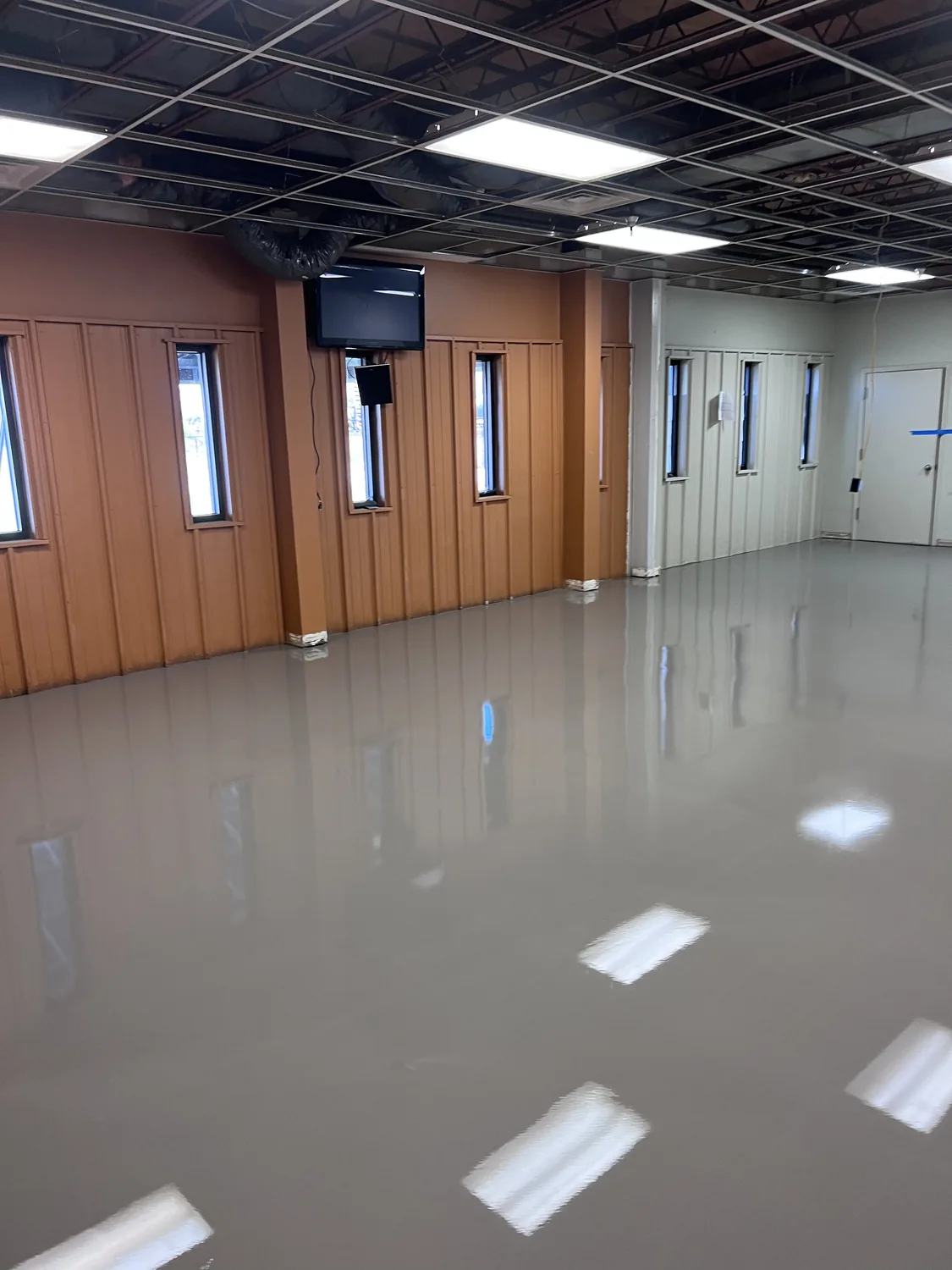 Capped and flattened floor in the Wire Crafters breakroom, ready to receive luxury vinyl plank